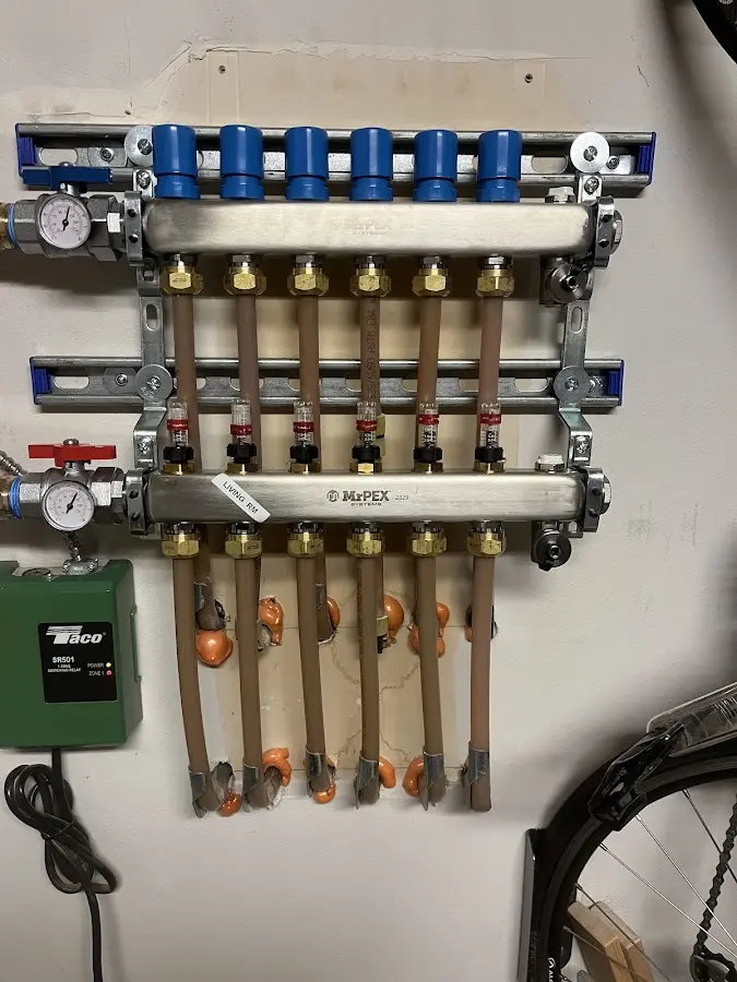 Plumber performing Water Heater Repair at a residential property in Pennfield